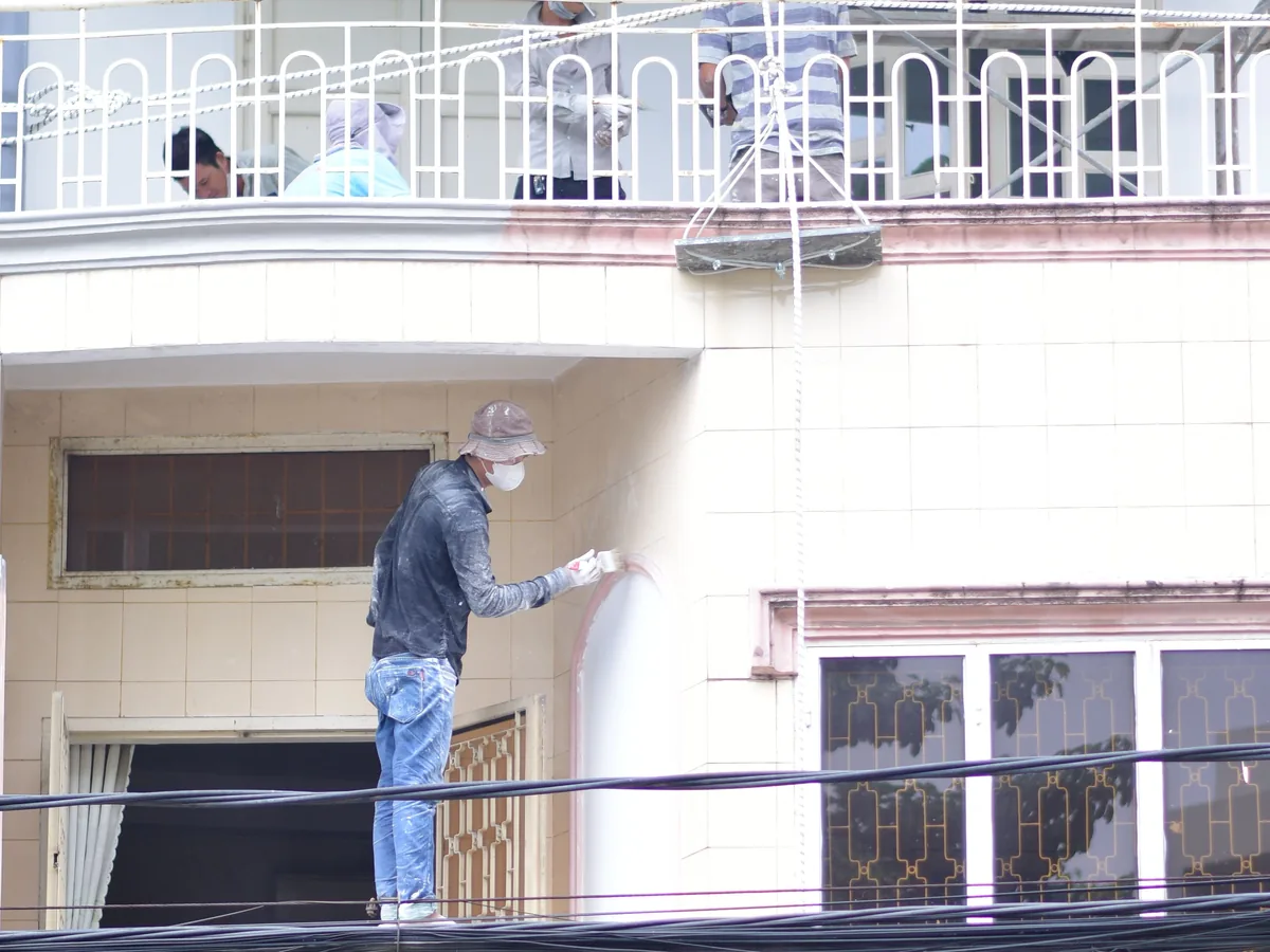 Exterior wall access and weather-aware coating